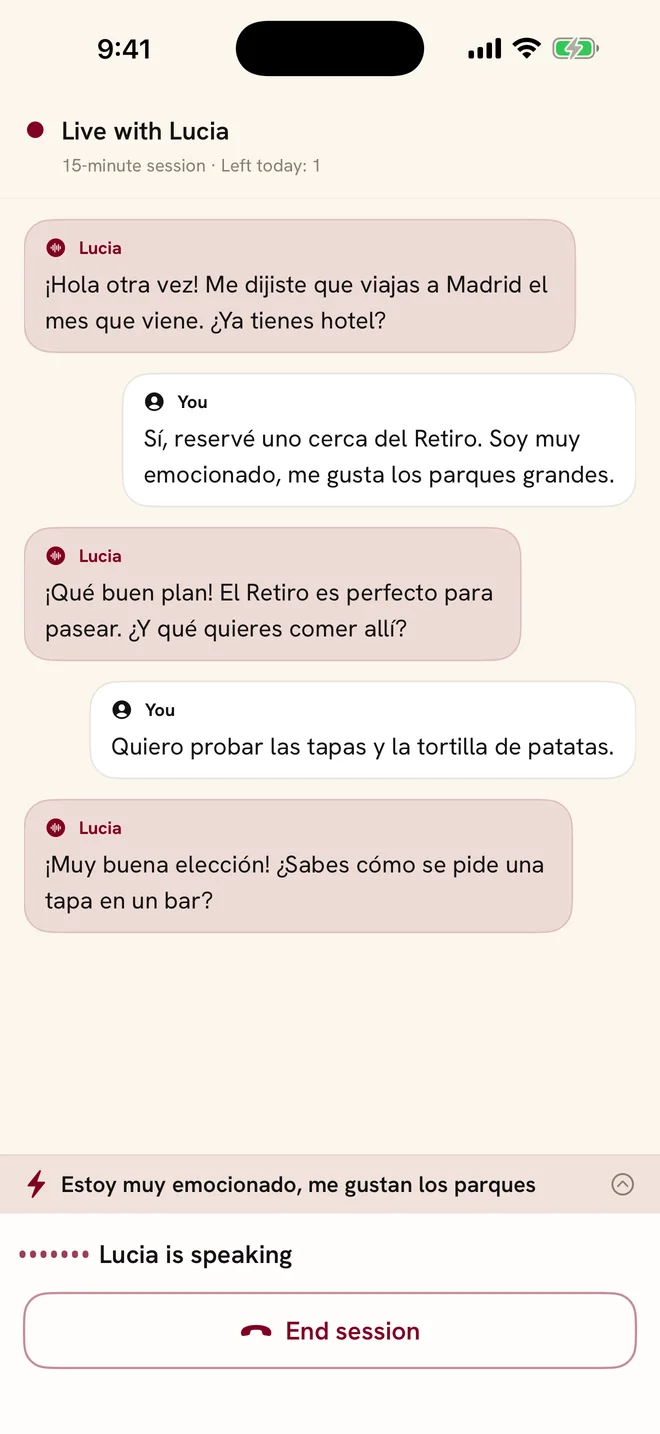 The live conversation screen: Lucia asks in Spanish about a trip to Madrid and the learner answers.